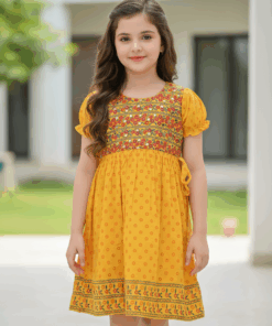 Smiling girl wearing yellow floral printed A-line frock from My Craft
