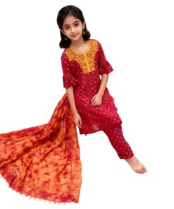 Girl sitting wearing maroon and yellow 3 piece outfit from My Craft